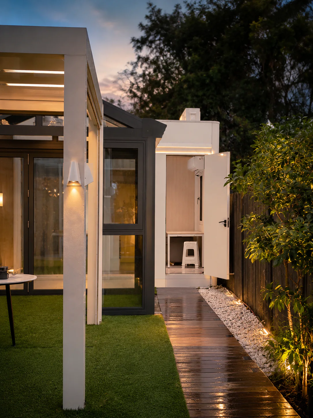 FreshPod showroom garden room and side access at dusk